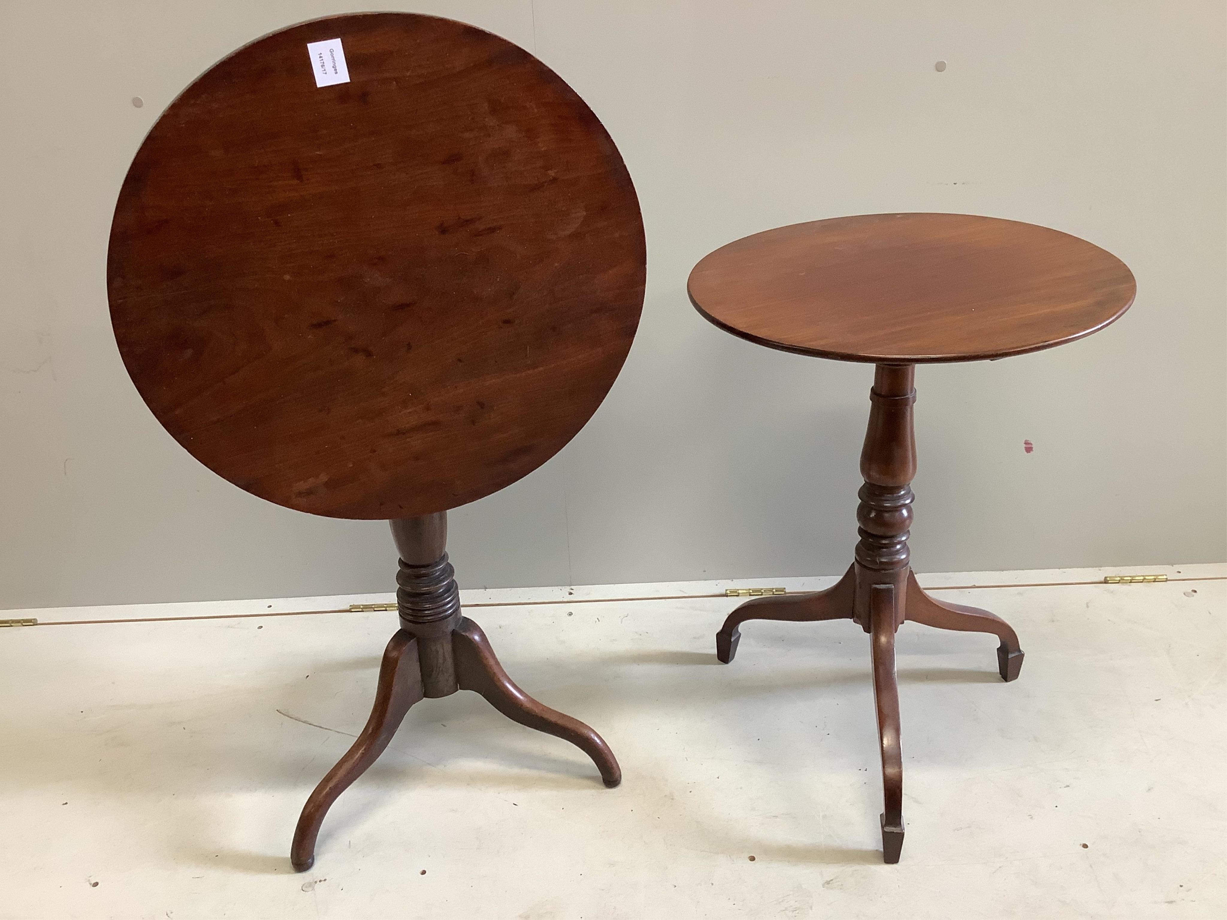 A near pair of Victorian circular mahogany tripod wine tables, larger diameter 57cm, height 71cm. Condition - fair